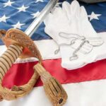 Gun Rights Showdown Inside VA Mega-Bill A military sword, dog tags, and white gloves displayed on an American flag
