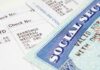 Close-up of a pay stub and a social security card