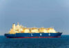 Hormuz Gamble Shocks Markets LNG tanker ship sailing on open sea.