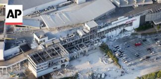Rescuers search for survivors in destroyed Aeon mall in Japan after earthquake
