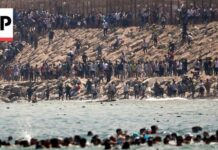 Border Meltdown Stuns Spain Thousands of migrants swim around the border from Morocco into Ceuta, Spain
