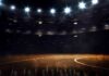 Basketball court under bright arena lights