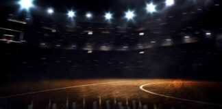 Basketball court under bright arena lights