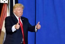 China Arming Iran? Xi’s Promise Tested man in suit giving two thumbs up