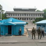 Rubio’s Terror Summit Sparks Global Uproar Military personnel standing near blue buildings at a border crossing