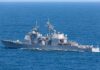 Iran Hit Hard — Retaliation Looms Gray naval warship cruising on open sea