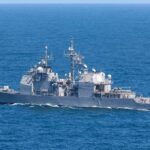 Iran Hit Hard — Retaliation Looms Gray naval warship cruising on open sea