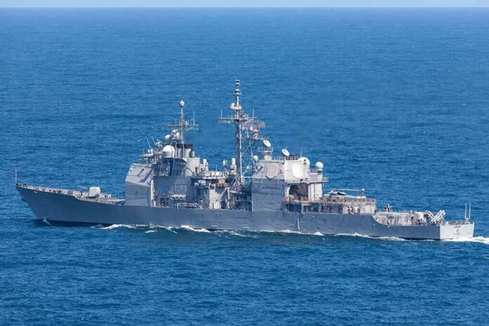 shutterstock_1408246997 Gray naval warship cruising on open sea