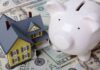 Birthday Cash Bomb Targets 25 Million Kids A model house next to a white piggy bank on a bed of dollar bills