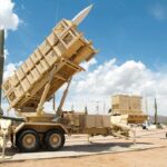 Patriot Shortage: Pentagon Admits Vulnerability Patriot missile defense system on display outdoors with various missiles in the background