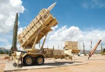 Patriot Shortage: Pentagon Admits Vulnerability Patriot missile defense system on display outdoors with various missiles in the background