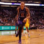 Sophie Cunningham’s Stand Lights Media Inferno basketball player dribbling on a court during a game