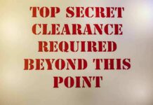 Gates’ Nuclear Clearance Bombshell Sign with red stenciled letters on a beige background