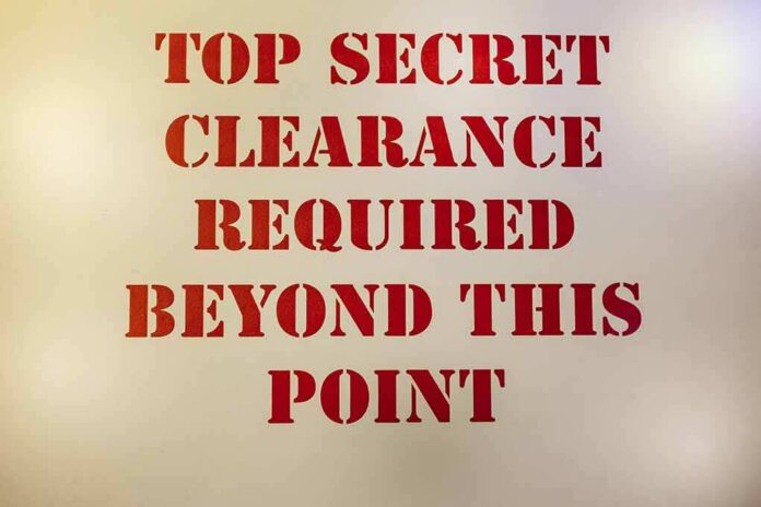 Sign with red stenciled letters on a beige background
