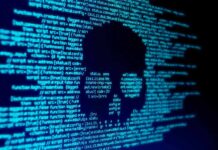 Organized Gangs Track Journalist—Police Panic skull silhouette in blue computer code