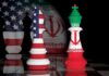 Pay Up, Iran — Shocking New Demand Chess kings with United States and Iran flags facing each other