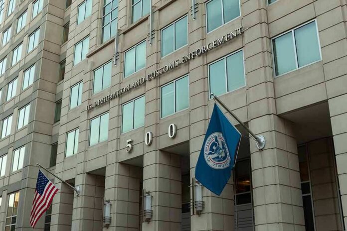 shutterstock_1485768215 U.S. government building facade with American and blue departmental flags