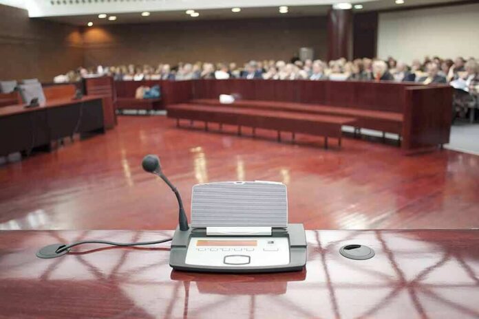 shutterstock_184839521 Conference microphone on a podium in a courtroom