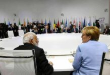 Bombs Grounded: Trump Stuns Tehran delegates seated around a large round conference table