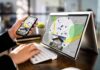Person using phone and laptop with real estate map app