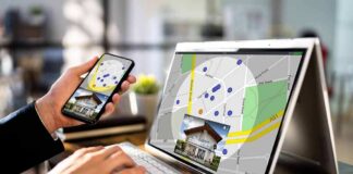 Person using phone and laptop with real estate map app