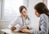 Painful Turn: Biden Cancer ‘Spread Further’ Doctor consulting a patient at a desk