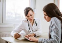 Painful Turn: Biden Cancer ‘Spread Further’ Doctor consulting a patient at a desk