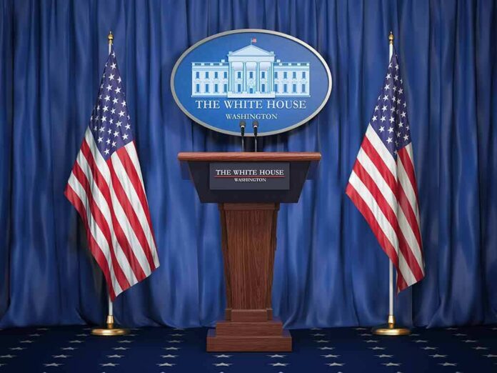 White House press podium with microphones and two American flags
