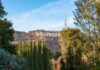 Hollywood Mega-Merger Inches Closer Hollywood Sign on hillside framed by trees