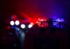 News Chopper Plunges Near Bus Wreck Police car light bar flashing red and blue at night