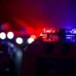 News Chopper Plunges Near Bus Wreck Police car light bar flashing red and blue at night