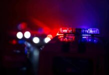 News Chopper Plunges Near Bus Wreck Police car light bar flashing red and blue at night