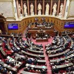 Trump Assassination Plot? Iran’s Alarming Move Parliament chamber with lawmakers seated in semicircular rows
