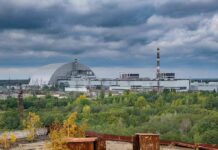 Shock Move: EPA Guts Plant Limits Nuclear power plant complex with domed sarcophagus and tall smokestack
