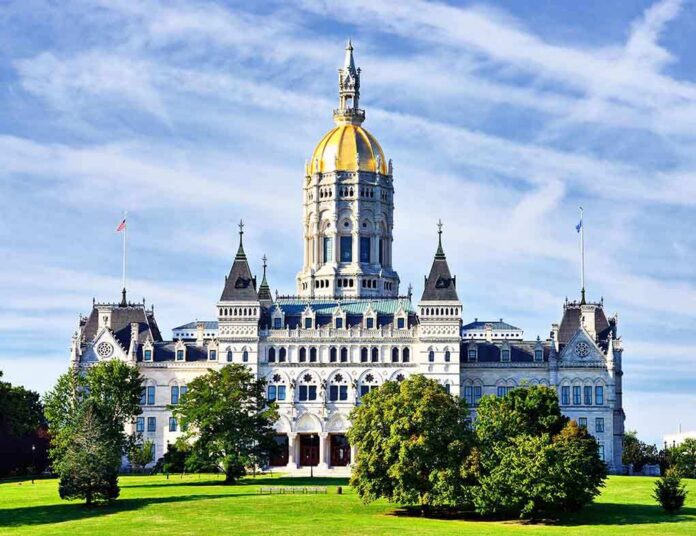 shutterstock_152023763-1 Connecticut State Capitol building with a golden dome and surrounding greenery