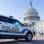 Car Jumps Curb Near White House – Chaos Police SUV parked near the United States Capitol building