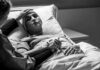 Early Alzheimer’s? One Vial Changes Everything Patient in hospital bed with nasal oxygen held by visitor