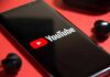 Battery Shock: Apple Promises 45 Hours smartphone displaying YouTube logo on red background