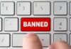 red banned key on computer keyboard