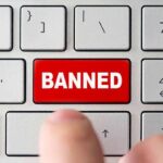 red banned key on computer keyboard
