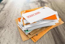 Mailman Betrays Hundreds of People on His Route Stack of mail with past due notice on top