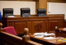 9/11 Fallout: VA Rules Flip empty courtroom with judge's bench and microphones