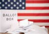 Red Sweep Jolts New Hampshire Ballot box with papers in front of an American flag