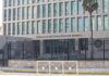 Sudden Escalation? Flights at Risk Embassy building behind tall black security fence