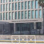 Sudden Escalation? Flights at Risk Embassy building behind tall black security fence