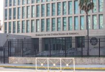 Sudden Escalation? Flights at Risk Embassy building behind tall black security fence
