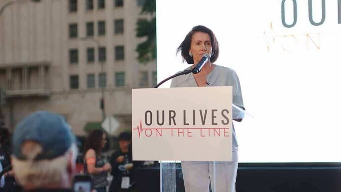 shutterstock_1908089446 woman speaking at a podium during an outdoor event