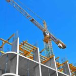 Construction Chaos: Hotel COLLAPSES, Sparks Outrage Tower crane over concrete building under construction