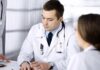 Three-Week Rule Could Save A Life Doctors in white coats discuss patient case at a table
