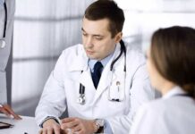 Three-Week Rule Could Save A Life Doctors in white coats discuss patient case at a table